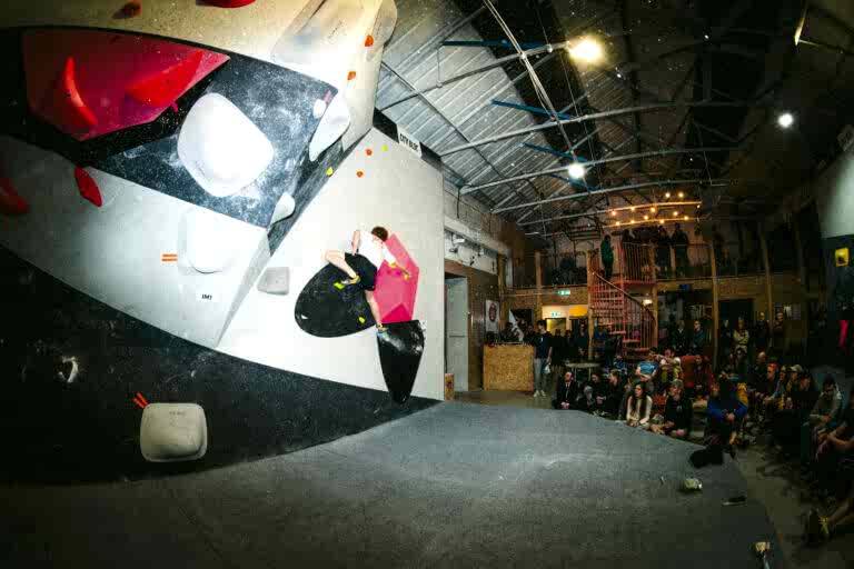 Climber mid-move at the City Bloc Winter League Final 2026